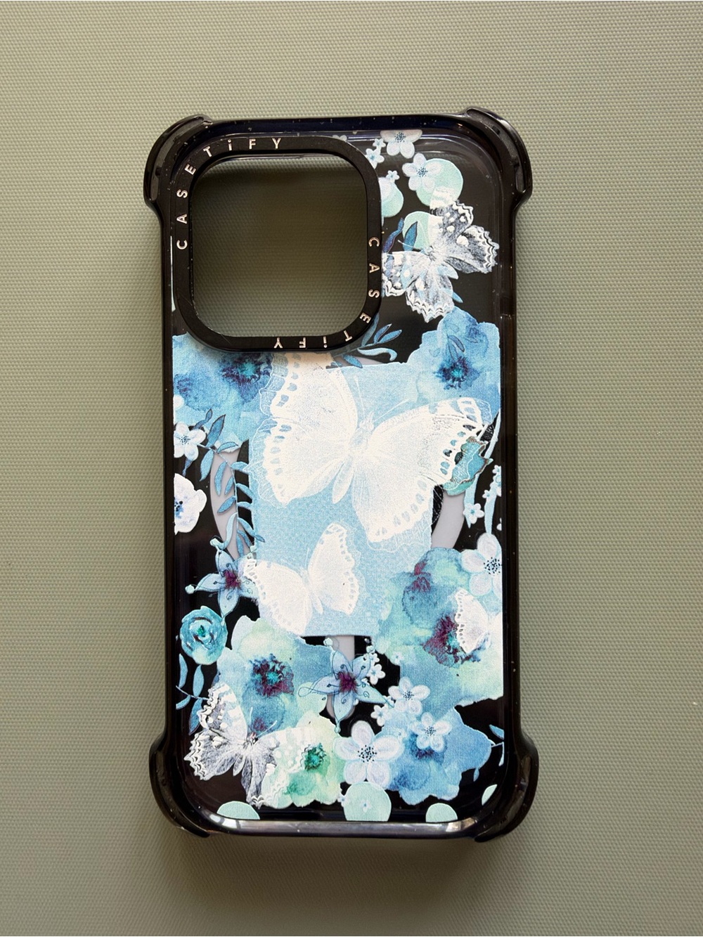 Casetify Black Phone Case with Blue Floral & White Butterfly Design